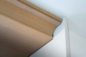 Moulded timber head detail showing concealed air conditioning system in operation