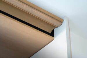 Moulded timber head detail showing concealed air conditioning system in operation